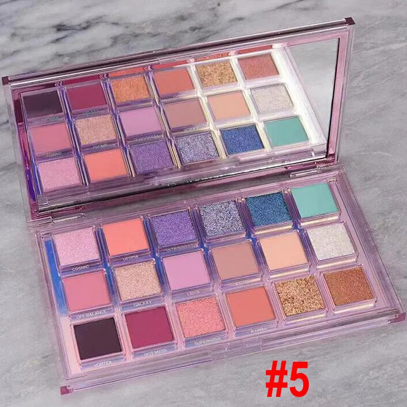 Eyeshadow palette in use with makeup brush applying pigment