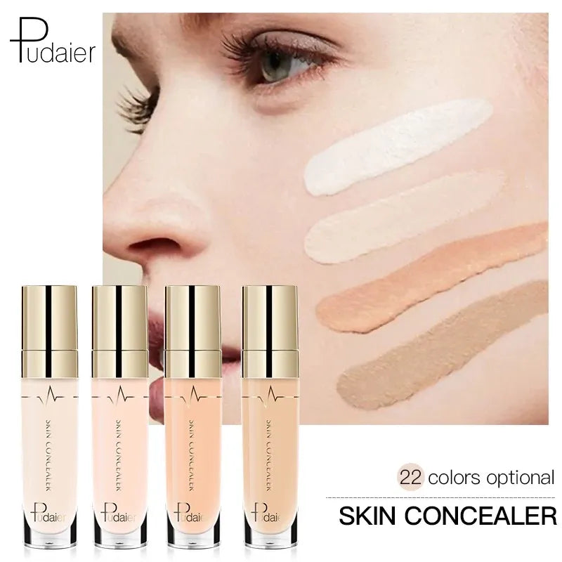 Liquid concealer bottle with doe-foot applicator on clean surface