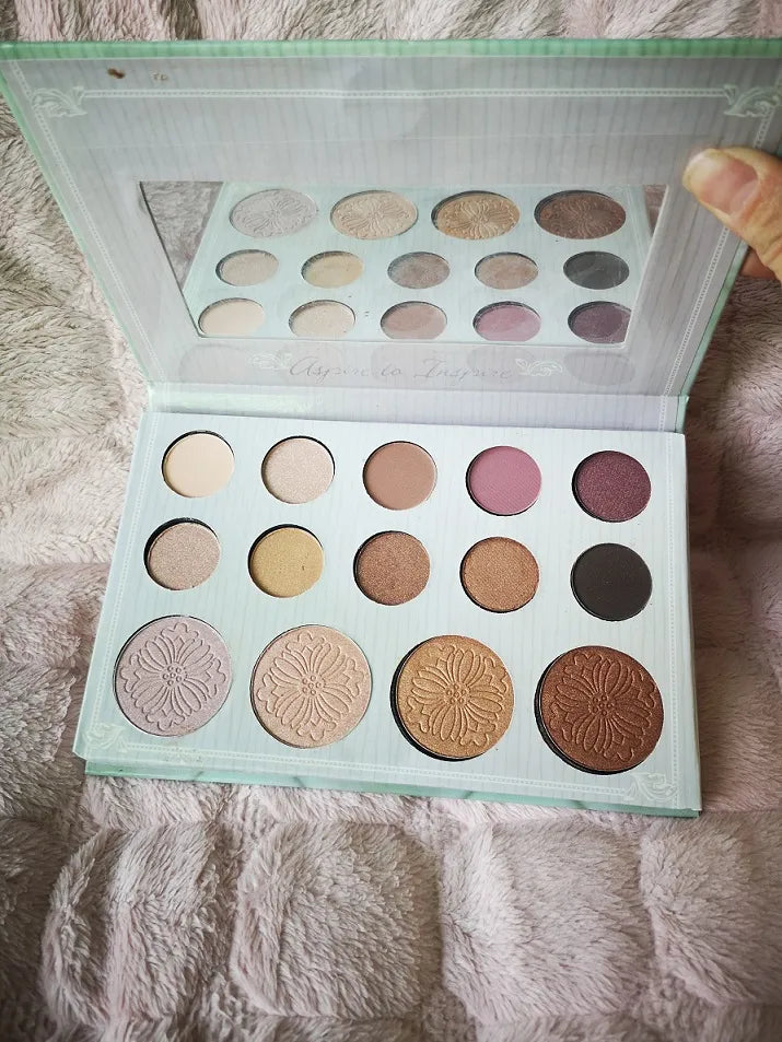 Swatch demonstration of eyeshadow and highlighter shades on skin