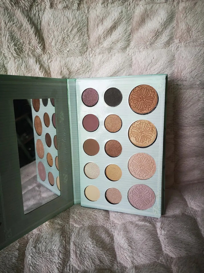 Close-up view of luminous pigment texture in the palette