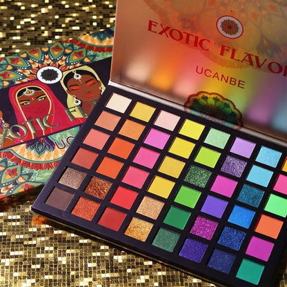 Close-up view of green and metallic eyeshadow shades in palette