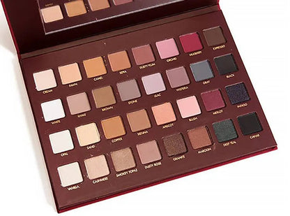 32-color eyeshadow palette showing neutral to bold shades in a compact case
