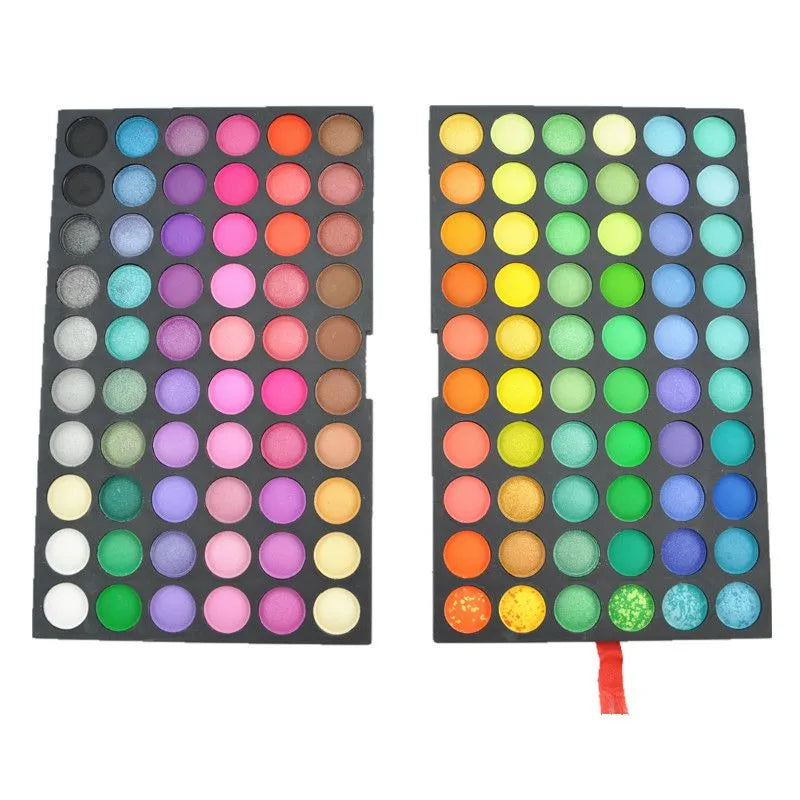 Close-up view of pigmented powder eyeshadow shades in the professional cosmetic palette