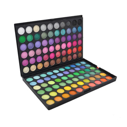 Close-up view of pigmented powder eyeshadow shades in the professional cosmetic palette