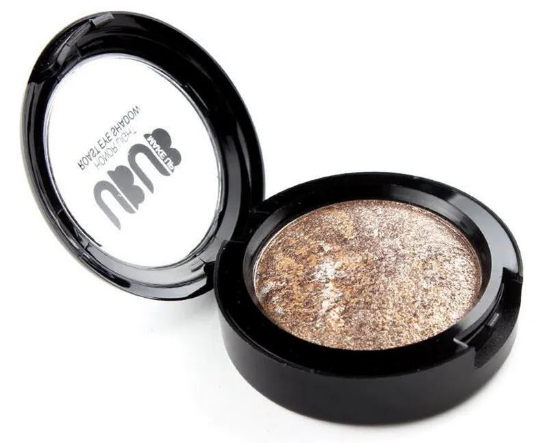 Open 12-color nude eyeshadow palette showing matte and glitter shades