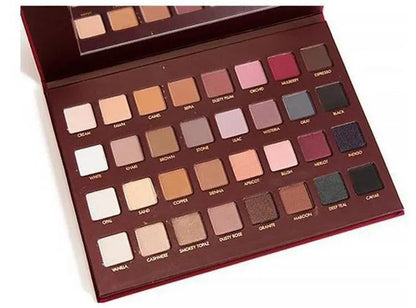 Eyeshadow palette open with 32 shades arranged in rows for easy selection