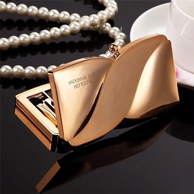 Open palette showing 10 complementary gold-toned eyeshadow shades