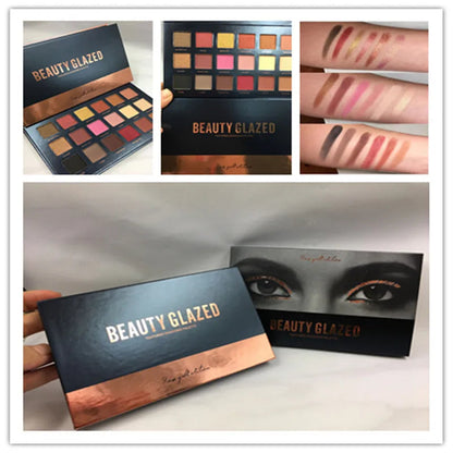 Open eyeshadow palette displaying matte and shimmer finishes in a compact design