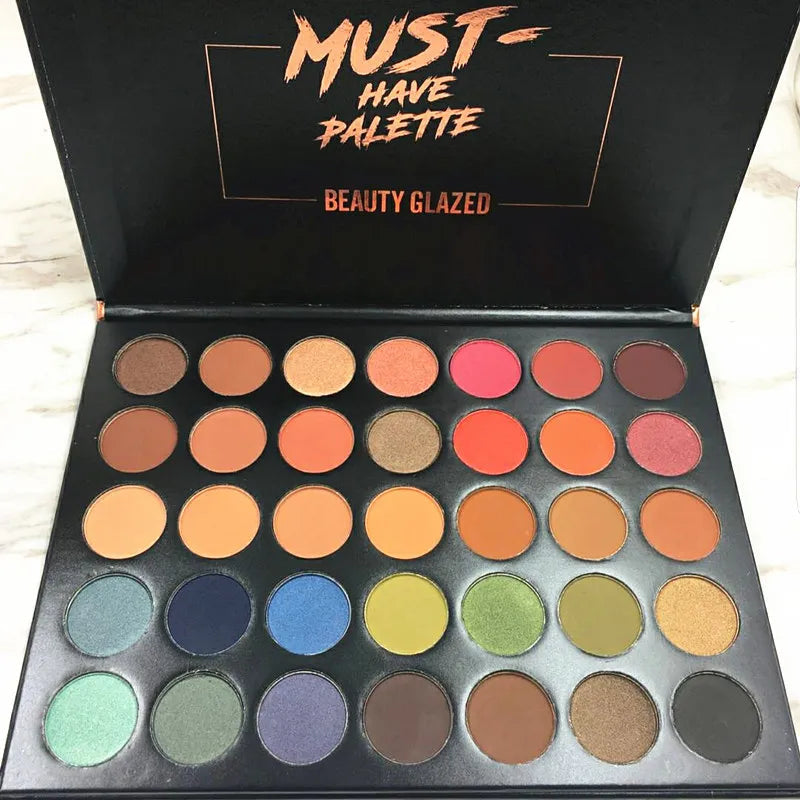 Close-up view of eyeshadow shades showing texture and color variety