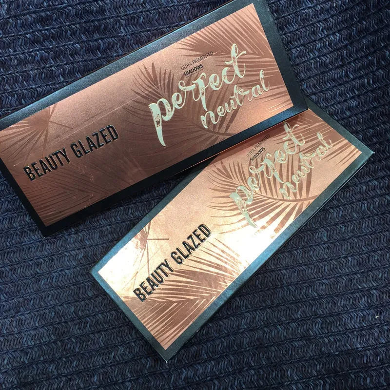 Close-up of eyeshadow palette showing matte and glitter texture