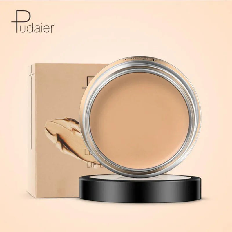 Concealer cream in a compact container with applicator