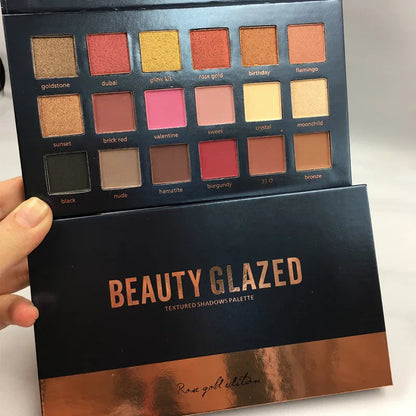 Front view of an 18-color eyeshadow palette showing rose gold and neutral shades