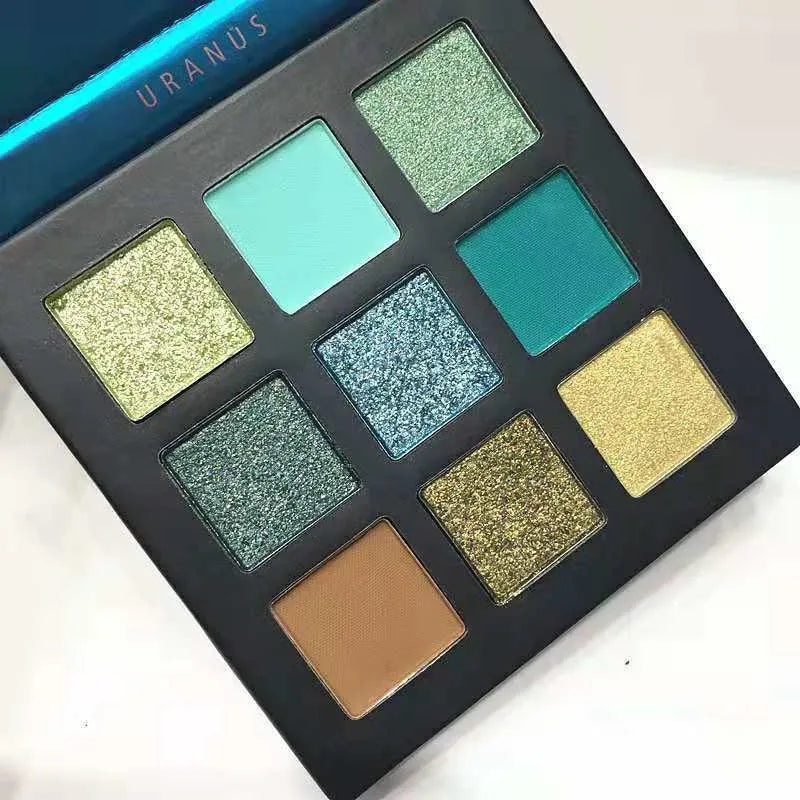 Eyeshadow palette open with brush for application demonstration