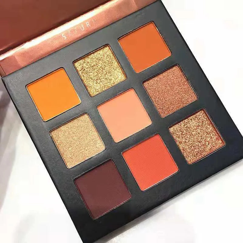 Eyeshadow palette open with brush for application demonstration