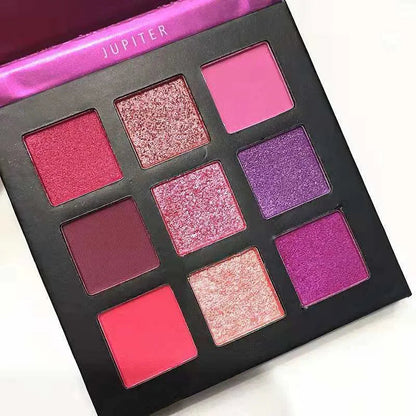 Compact eyeshadow palette with 9 shimmer and metallic colors arranged in a grid