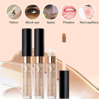 Close-up view of cream concealer texture with makeup brush nearby