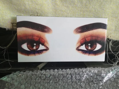 Open eyeshadow palette showing 12 shades in peach and nude colors