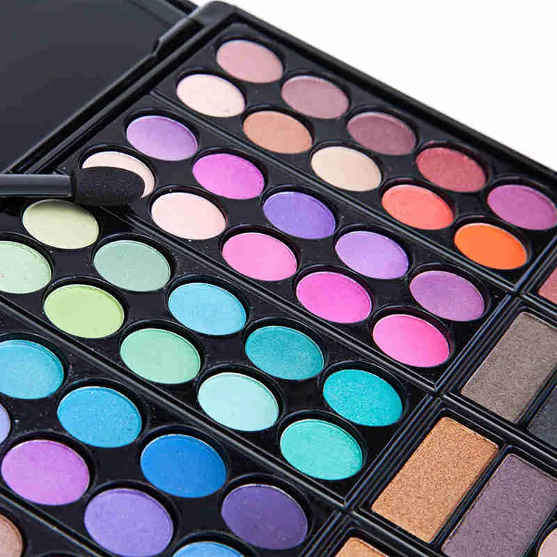 Close-up of eyeshadow palette with various color swatches