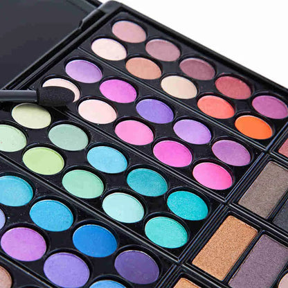 Close-up of eyeshadow palette with various color swatches