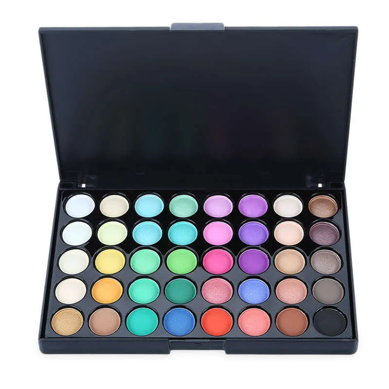 Eyeshadow palette with included brush on a neutral background