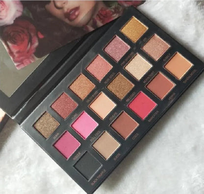 Eyeshadow palette open with all 18 colors visible for selection