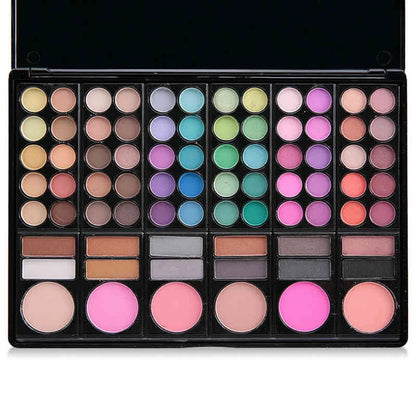 Close-up of eyeshadow palette with various color swatches