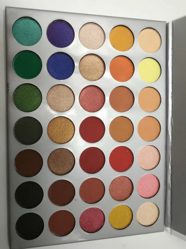 Makeup application using palette showing blended eyeshadow look