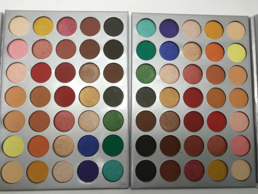 Close-up of eyeshadow palette with swatches of matte colors