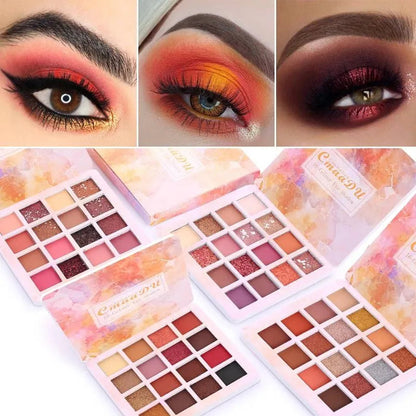 Hand holding eyeshadow palette with brush for application demonstration