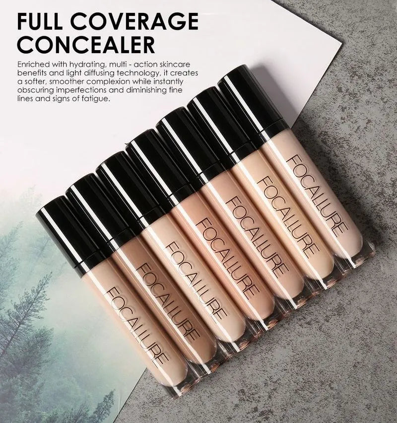 Seven different shades of liquid concealer displayed in individual containers