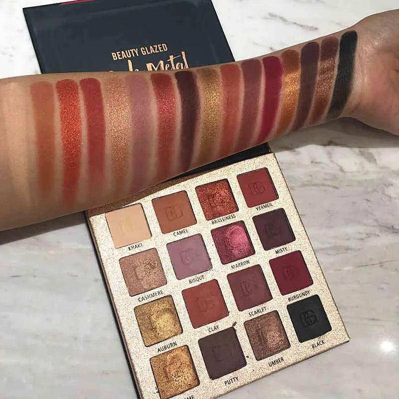 Open eyeshadow palette showing matte and glitter nude shades