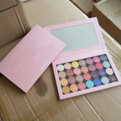 Close-up view of eyeshadow palette demonstrating blendable texture