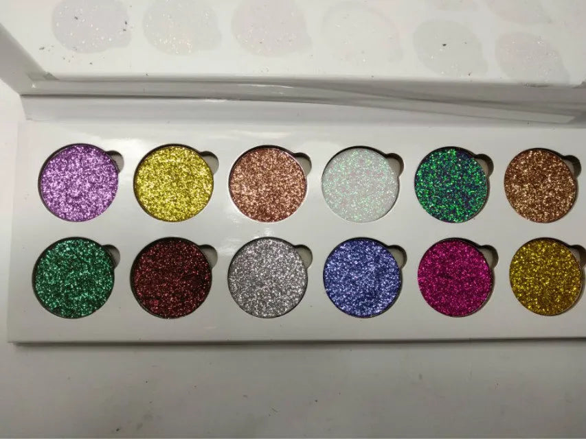 Open 12-color glitter eyeshadow palette showing shimmer shades