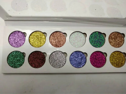 Open 12-color glitter eyeshadow palette showing shimmer shades