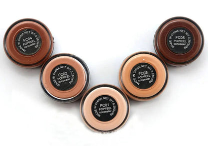 Makeup palette showing 10 circular cream cosmetic units arranged in two rows