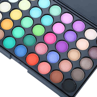 Close-up view of eyeshadow palette with glitter and matte shades