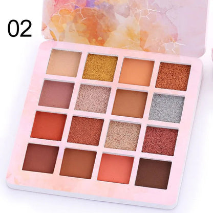 Hand holding eyeshadow palette with brush for application demonstration
