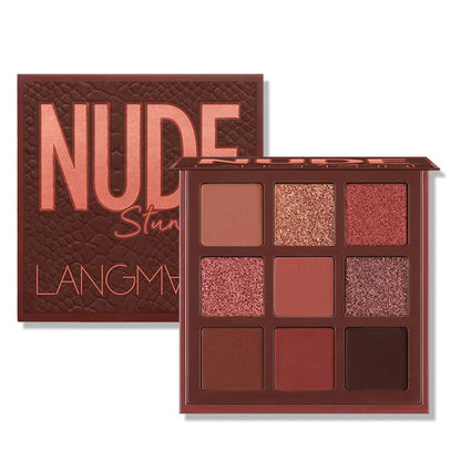 Eyeshadow palette open with mirror and nine powder shades arranged in grid