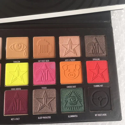 Open eyeshadow palette showing 18 different color shades