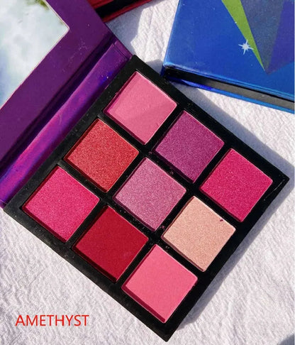 Swatches of eyeshadow colors from the palette on skin