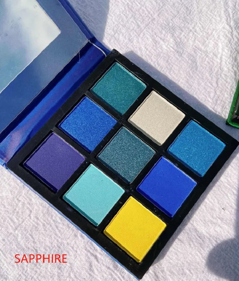 Swatches of eyeshadow colors from the palette on skin