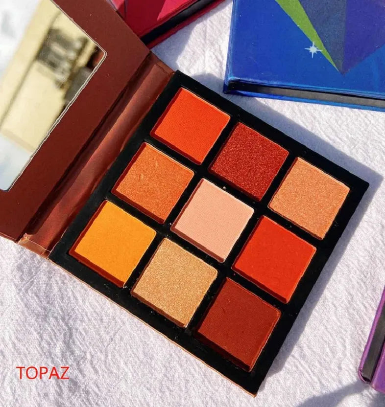 Compact eyeshadow palette with mirror for portable makeup application