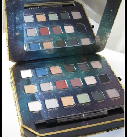18-color eyeshadow palette with eyeliner pencil displayed open
