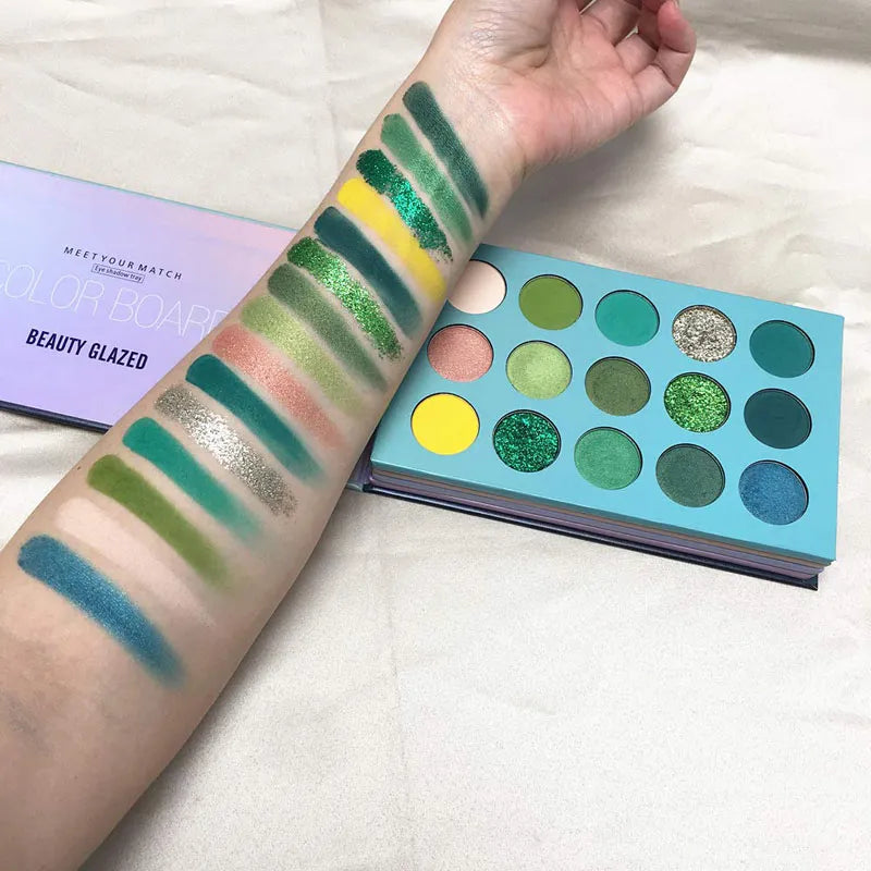 Close-up view of eyeshadow palette with glitter and nude color options
