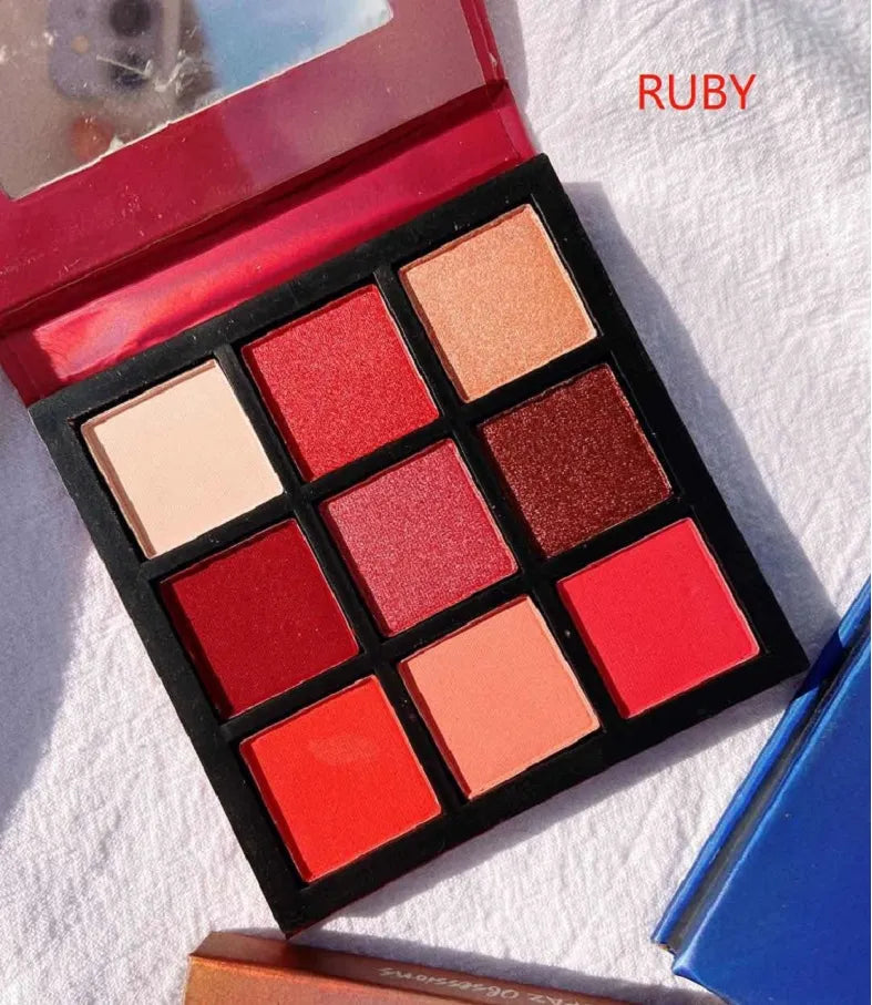 Open 9-color eyeshadow palette showing gemstone-inspired shades