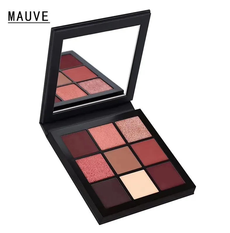 Swatches of eyeshadow colors from the palette on skin