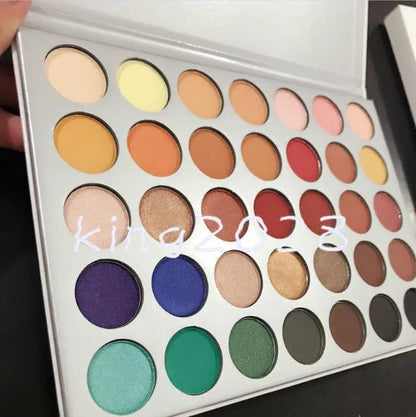 Makeup application using palette showing blended eyeshadow look